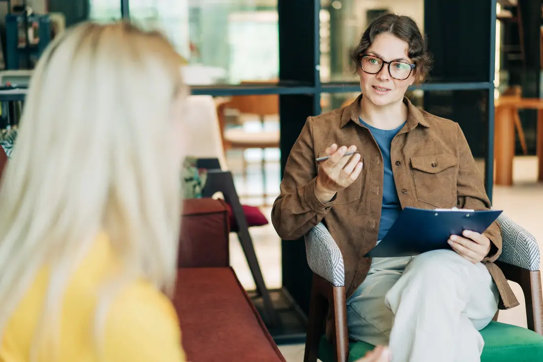 A counsellor talking with a client during a session